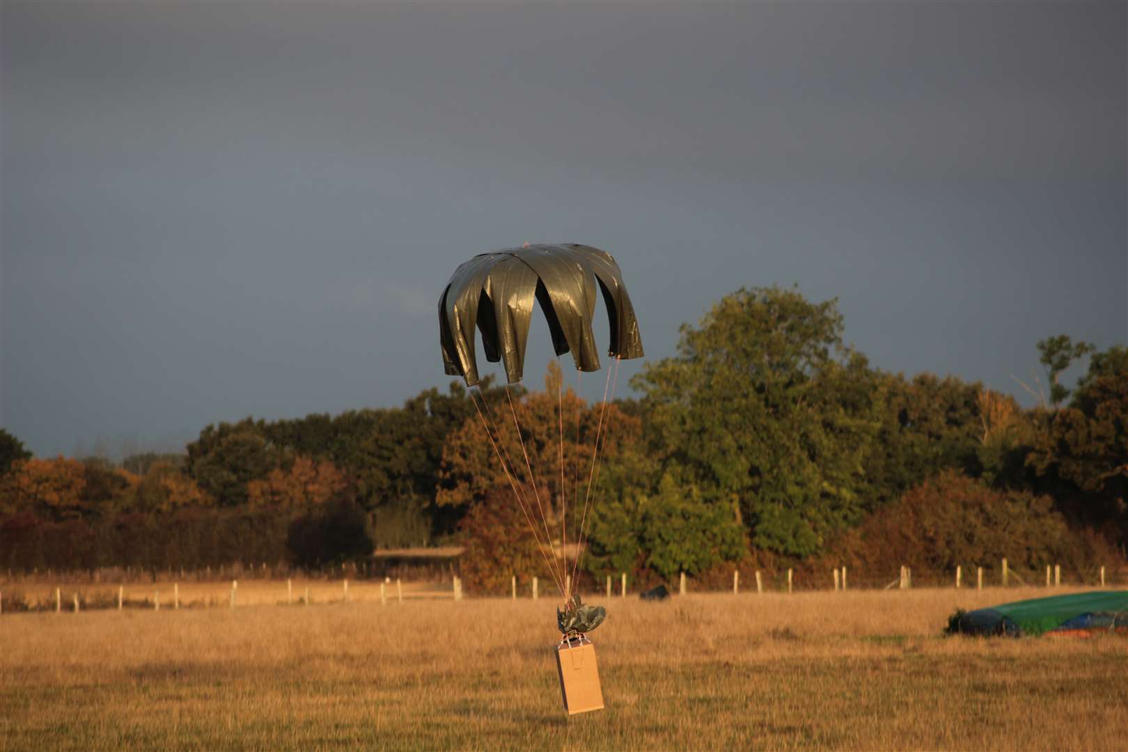 Air Drop Box packages are dropped from a plane by parachute during testing at Headcorn Aerodrome