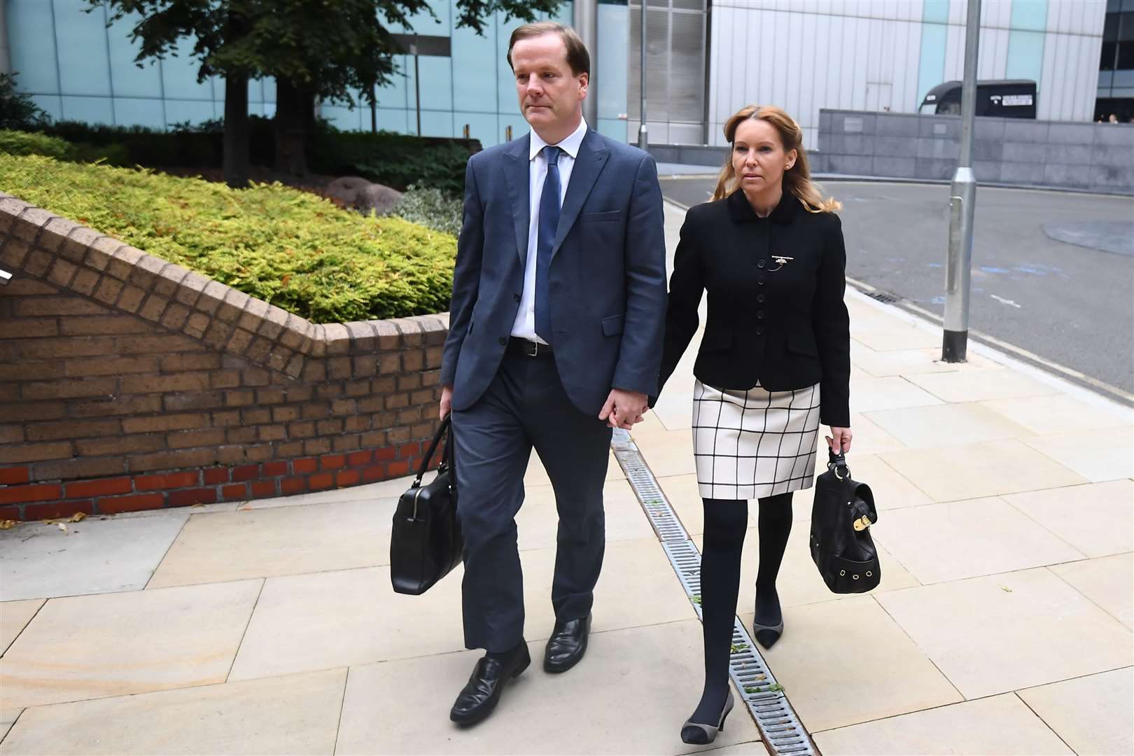 Ex-MP Charlie Elphicke arrives at Southwark Crown Court with his wife, Natalie, current Tory MP for Dover (Victoria Jones / PA)