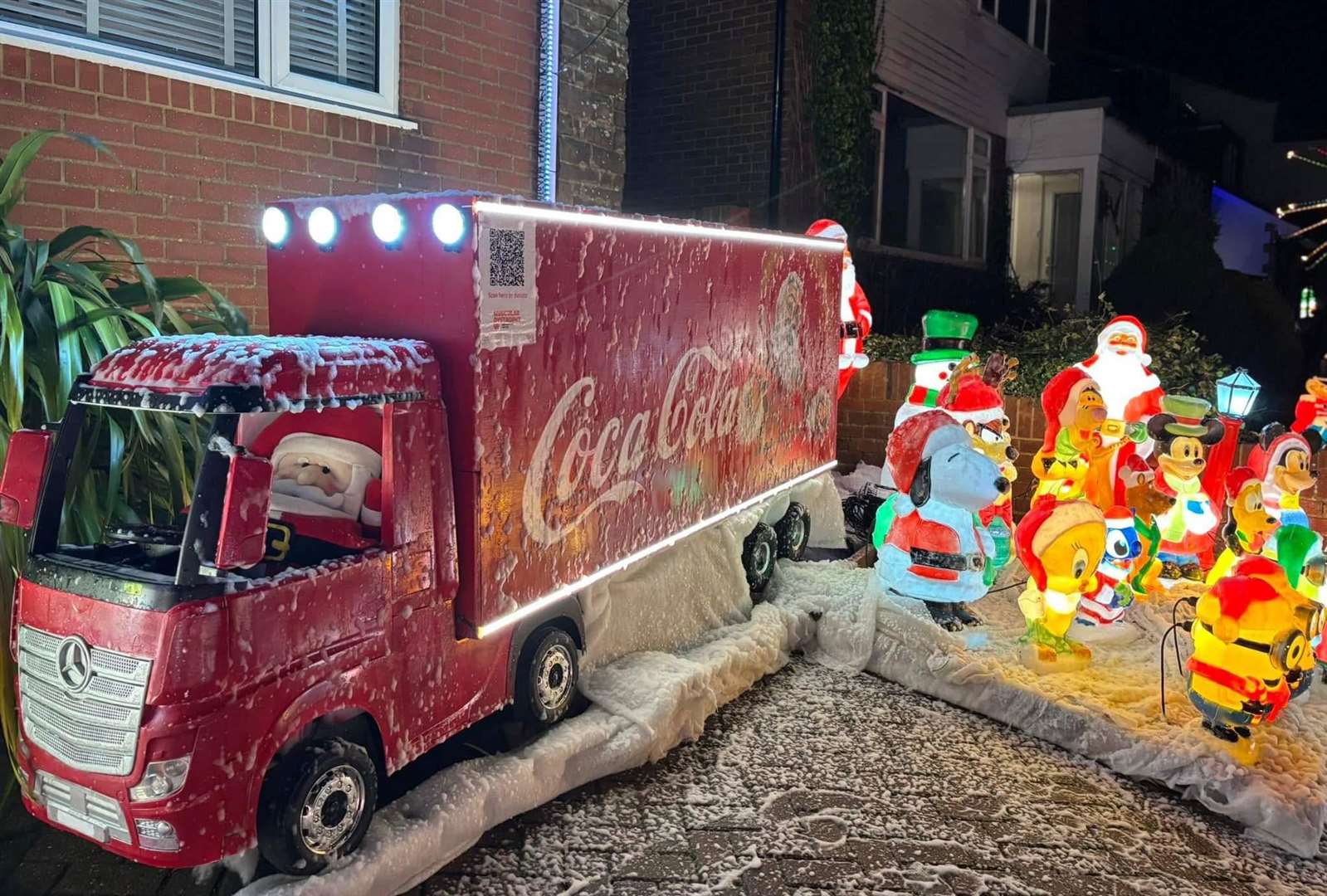 A Coca-Cola truck driven by Santa can be found outside the house. Picture: Zoe Murphy