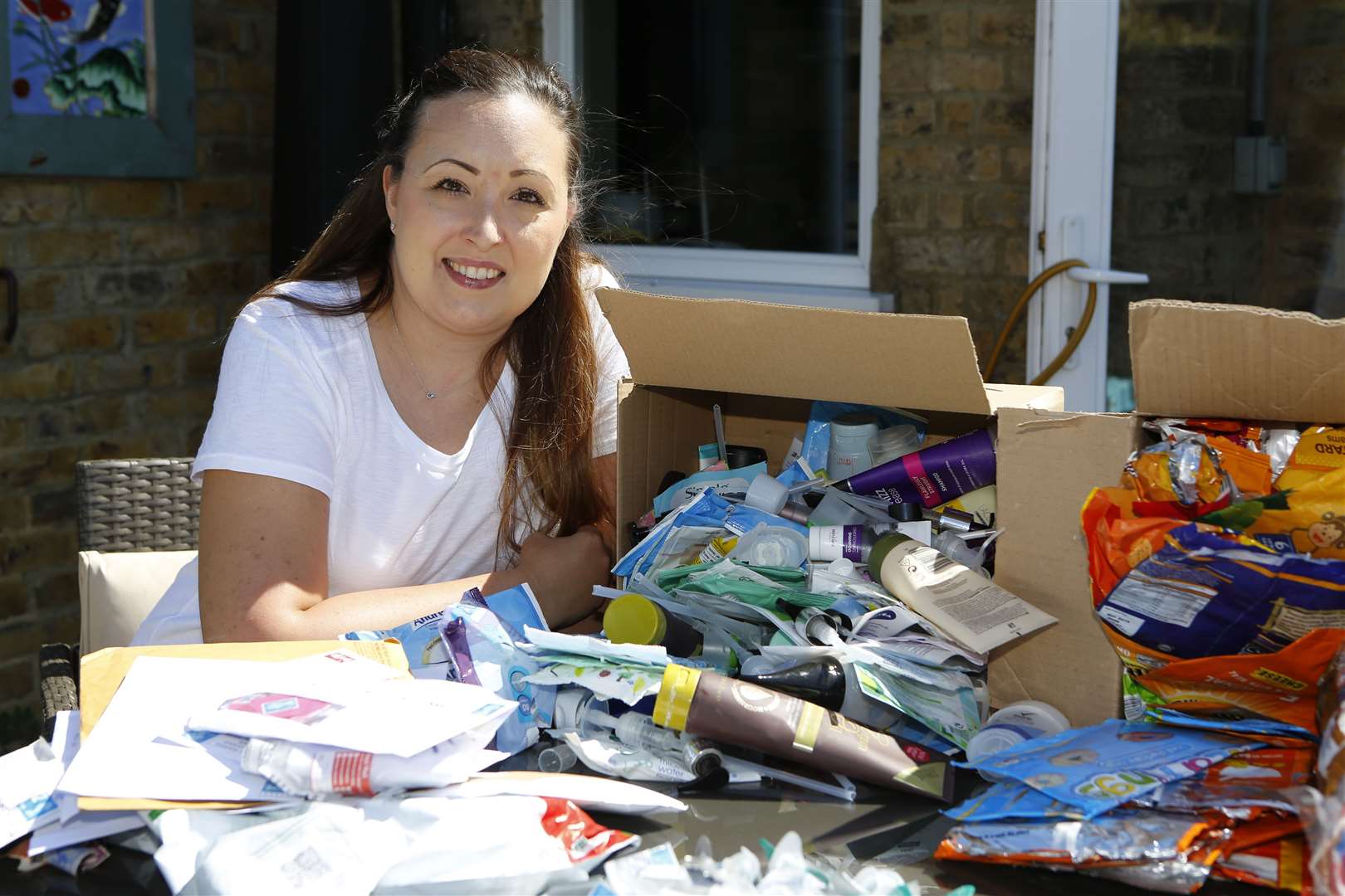 Rebecca Ruler sorting through the various types of plastic