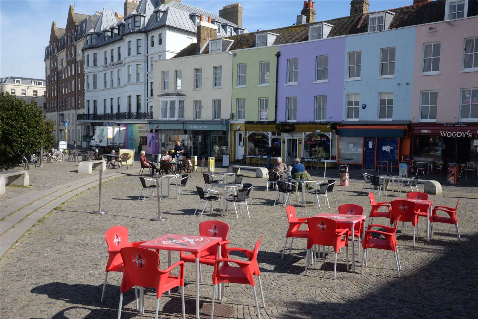 Empty tables around The Parade in Margate despite the sunny weather.