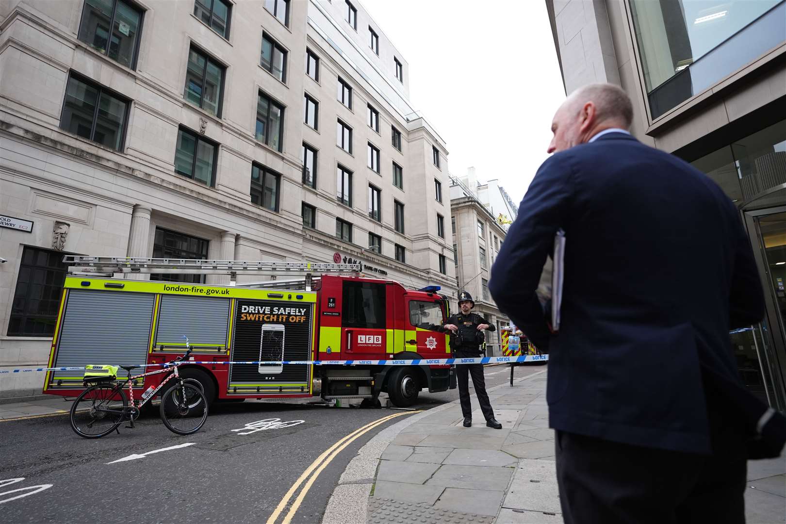 Firefighters in Old Jewry St in London after a fire broke out at the Lothbury restaurant (James Manning/PA)