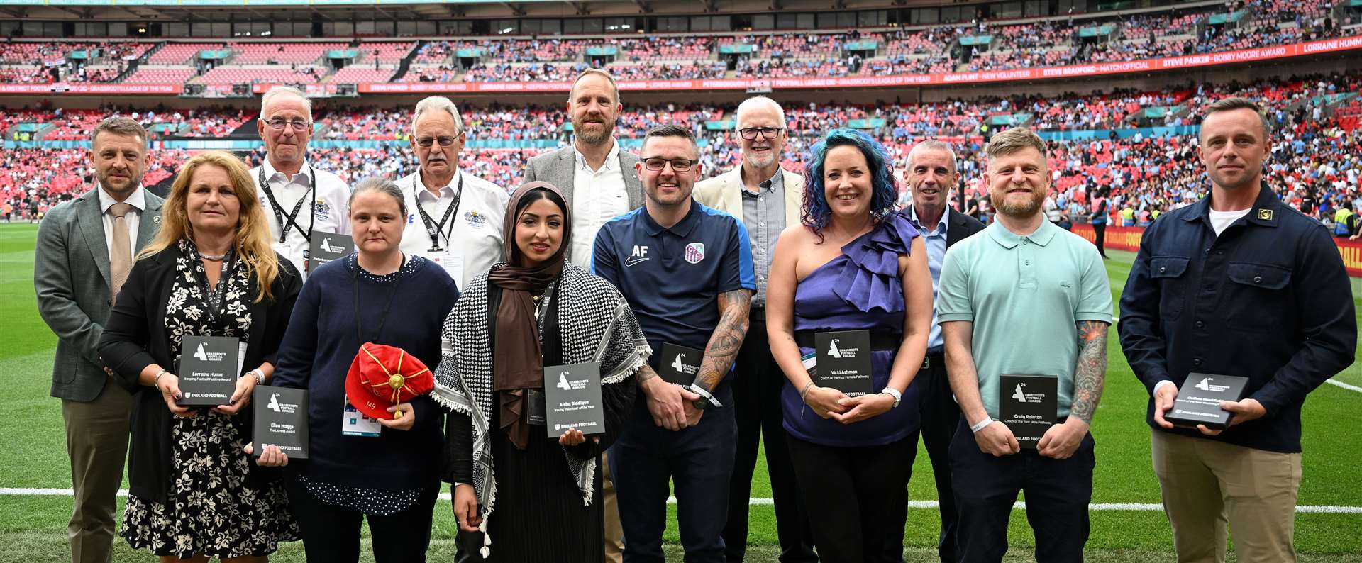 Anchorians chairman Leigh Willis, centre on the back row, with the other grassroots award winners on the hallowed turf at Wembley ahead of this month's Community Shield game. Picture: Michael Regan - The FA/The FA via Getty Images