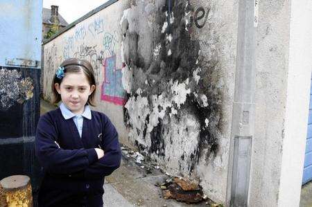 Casey Voysey, eight, has written to Medway Council to complain about rubbish being dumped in the alley by her house in Ferndale Road, Gillingham.