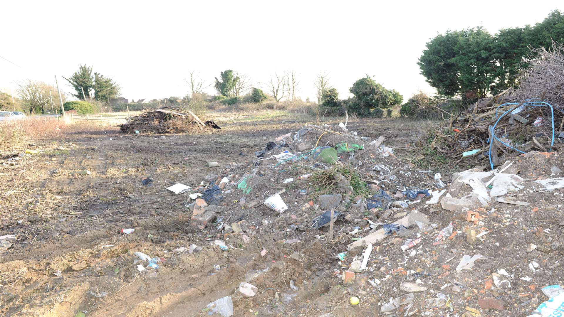 Piles of industrial waste dumped in Chequers Road, Minster.