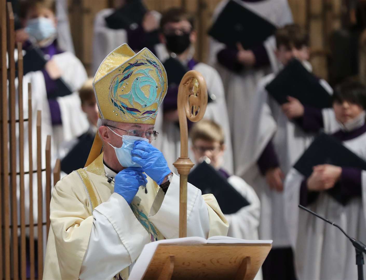 The Archbishop of Canterbury wore protective gloves and a face mask during the service (Gareth Fuller/PA)