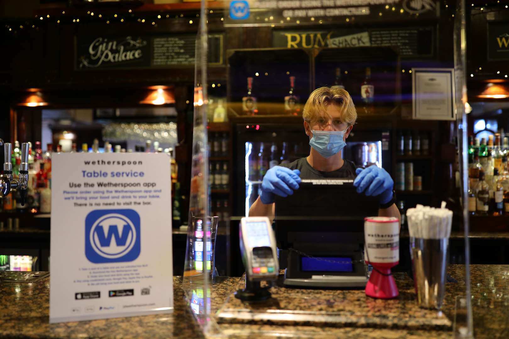 Bar staff were kitted out in PPE (Aaron Chown/PA)