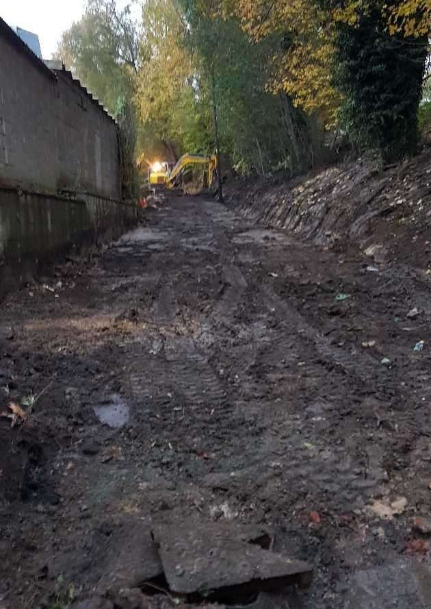 How the path looked after the foliage was cleared and before the tarmac was laid