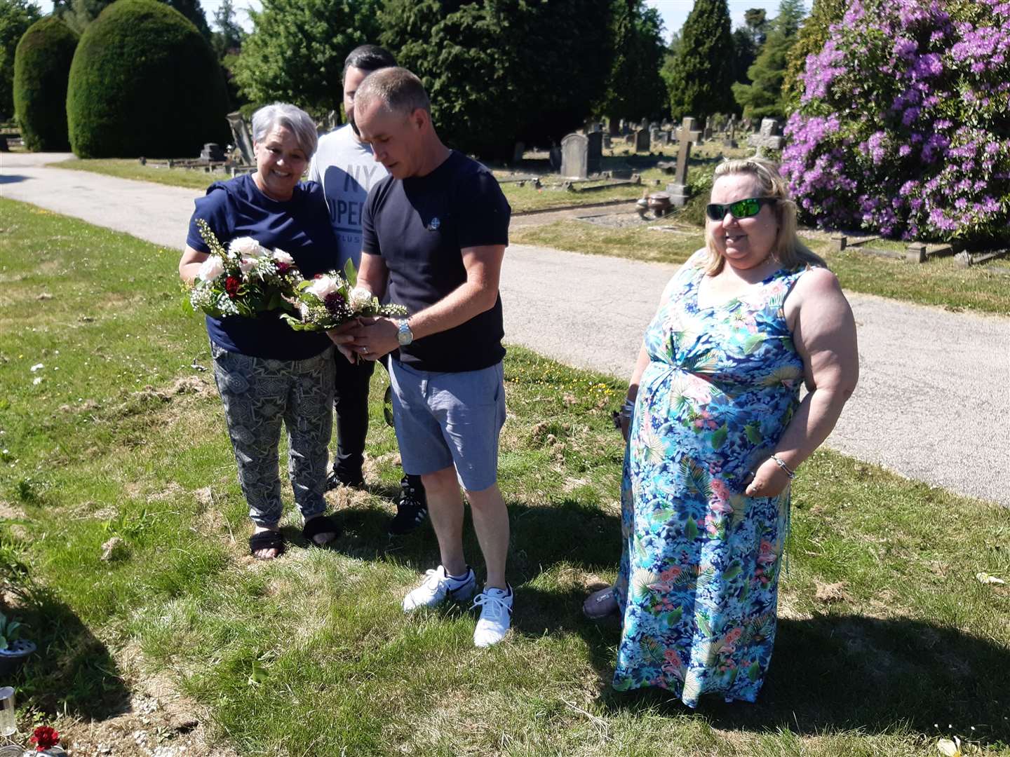 Claire Sharp, Bill Millen junior, Stephen Cullen and Karen Millen, by Bill Millen's grave in Maidstone Cemetery