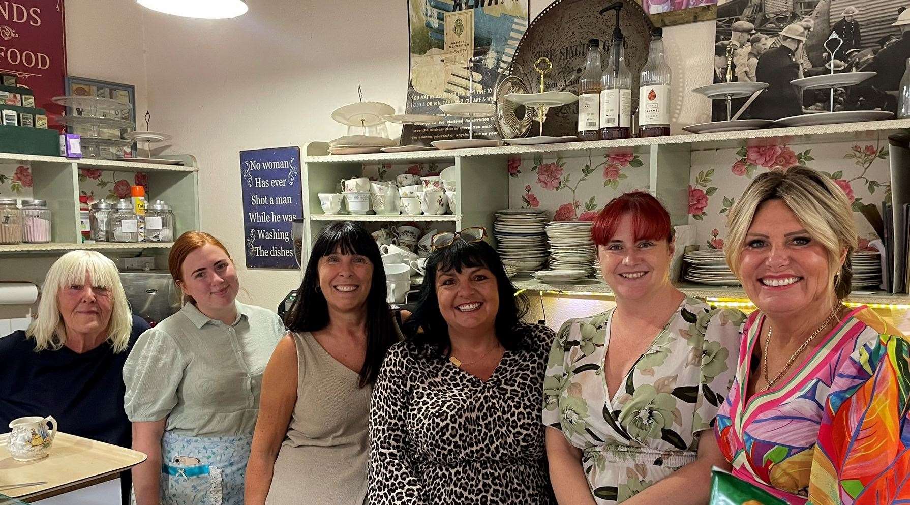 Owner of The Bay Leaf Cafe in Roman Sqaure, Sittingbourne, Joanne Povey (right) with her staff during the celebrations. Picture: Joe Crossley