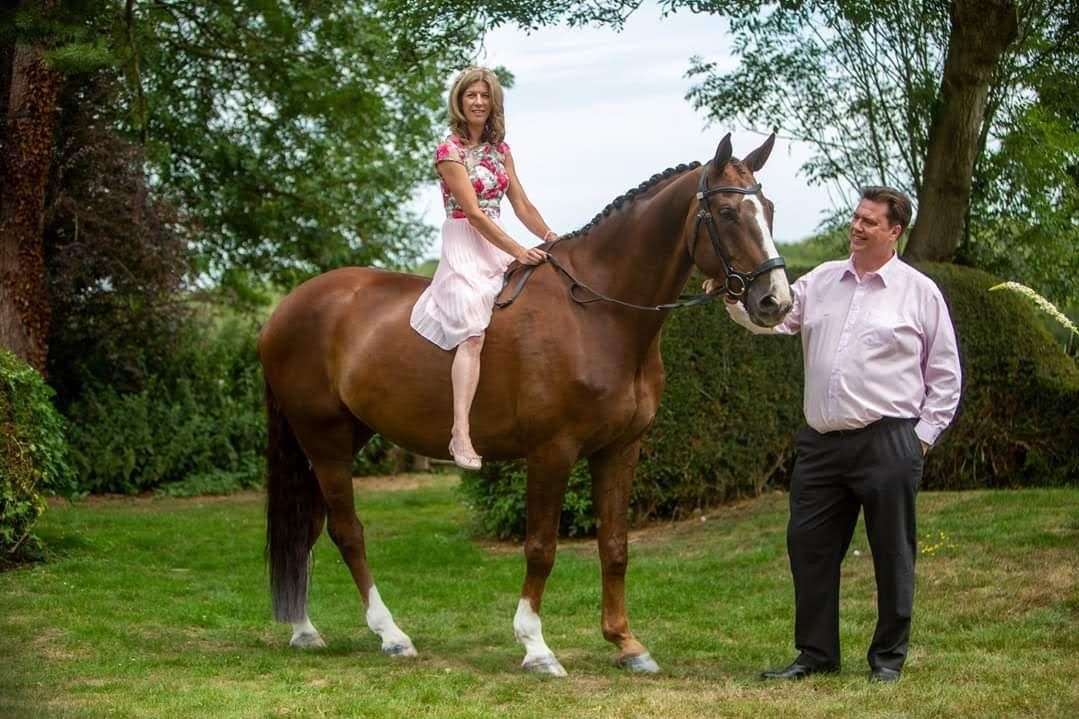 Rachel Taylor, nee Collins, with her guest of honour, Muddy on her wedding day.