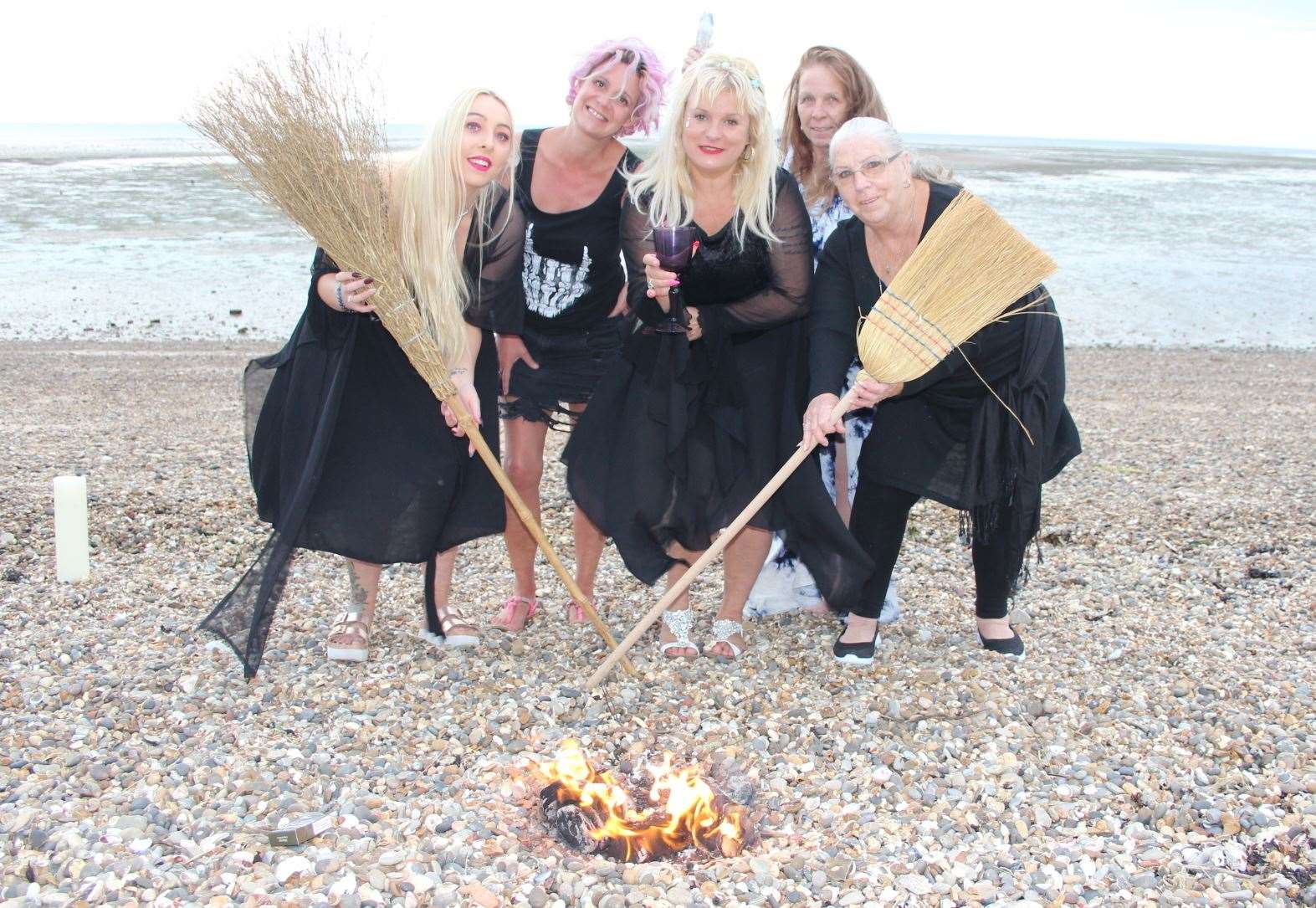 The witches of Sheppey with Charlotte Clark, centre, on the beach at Minster celebrating Lammas