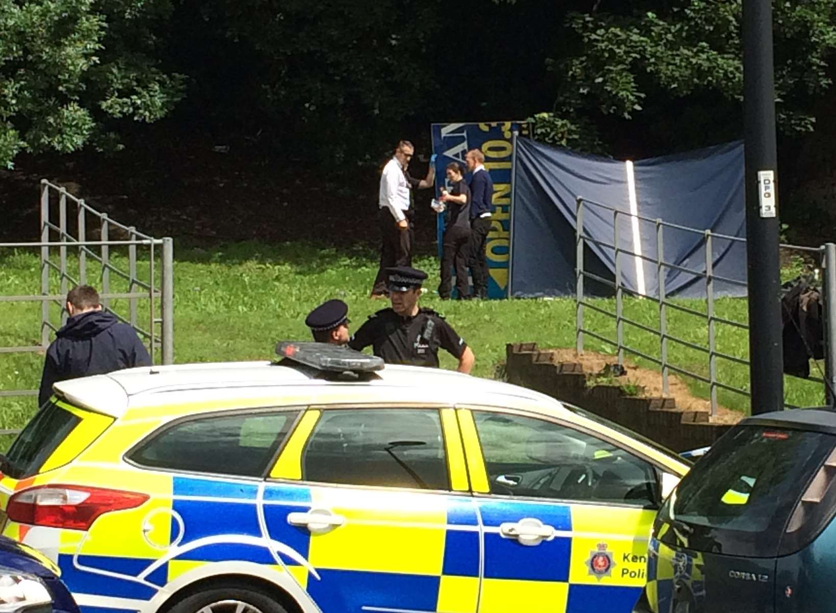 Police cars in Dock Road, Chatham, where Mr Paine's body was found