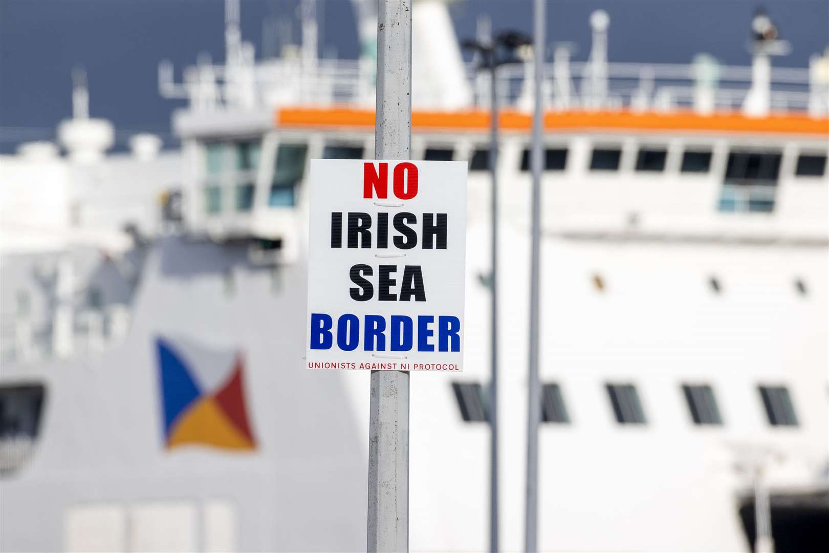 A sign on a lamppost outside Larne Port (Liam McBurney/PA)