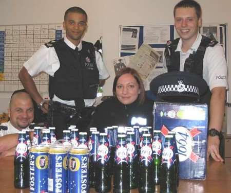 PC Trevor Bonett, PC Gabriel Chandler, SC Rachel Munt and PC James Williams with the seized alcohol