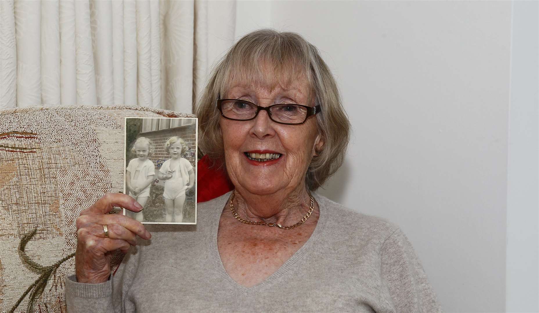 Helen Mill of Oakwood Court Maidstone has been sharing her memories of the war, with a picture of her (right) and her twin sister Wendy as a child.Picture: Sean Aidan (10537965)