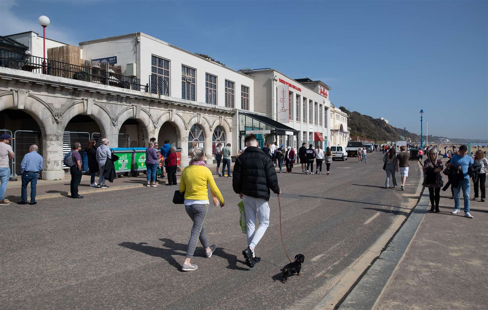 People walk along the sea front in Bournemouth (Andrew Matthews/PA)