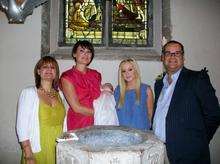 Helen Rouse,Emily Downs, Isla Downs, Catherine Rouse, Ian Gray. Generations of a family who have all worn the christening gown now worn by little Isla. The gown is 200 years old