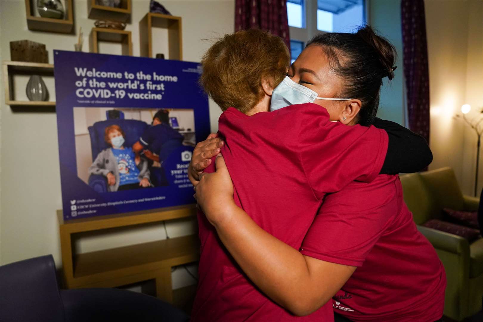 May and Margaret hug as they are reunited a year on (Jacob King/PA)