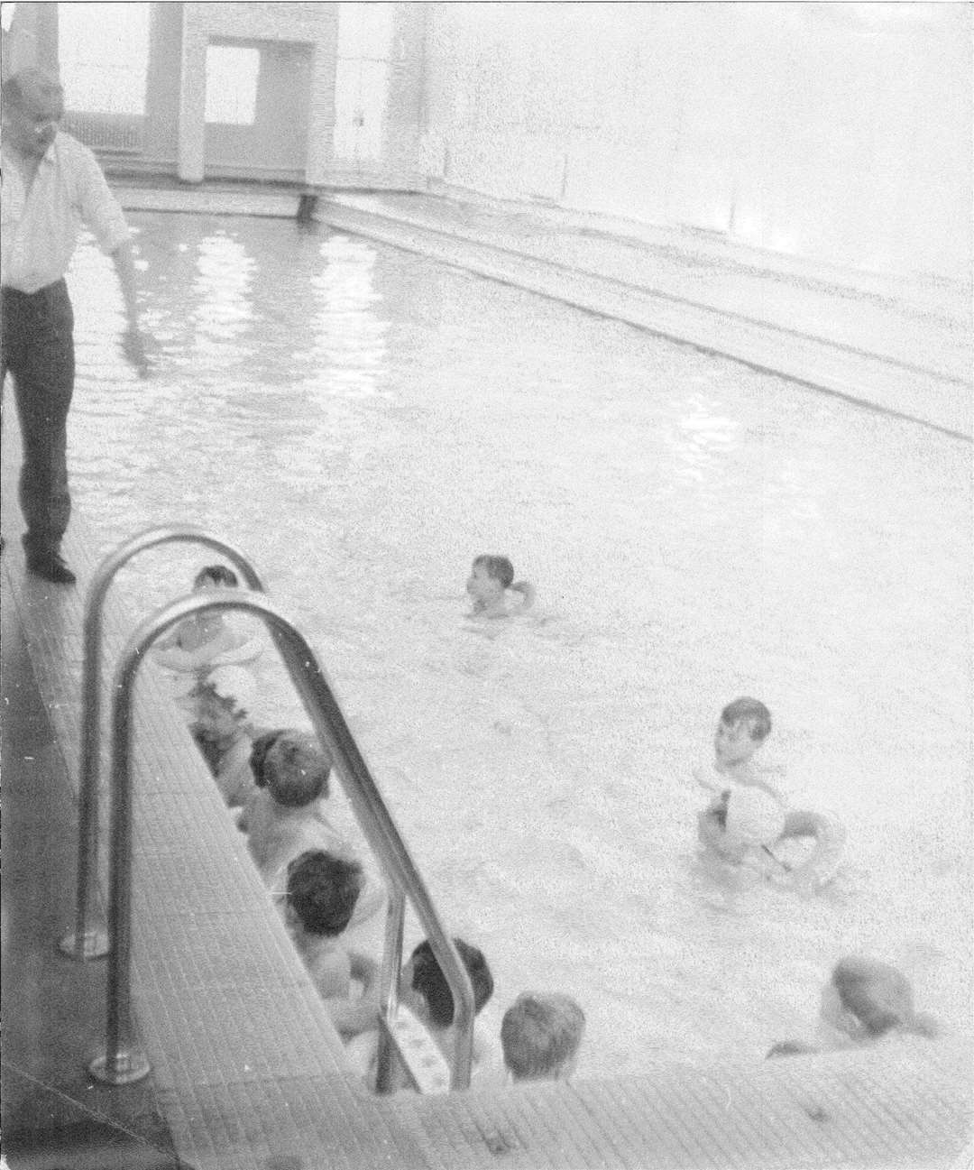 Mr McLaren teaching children to swim in the 1970s