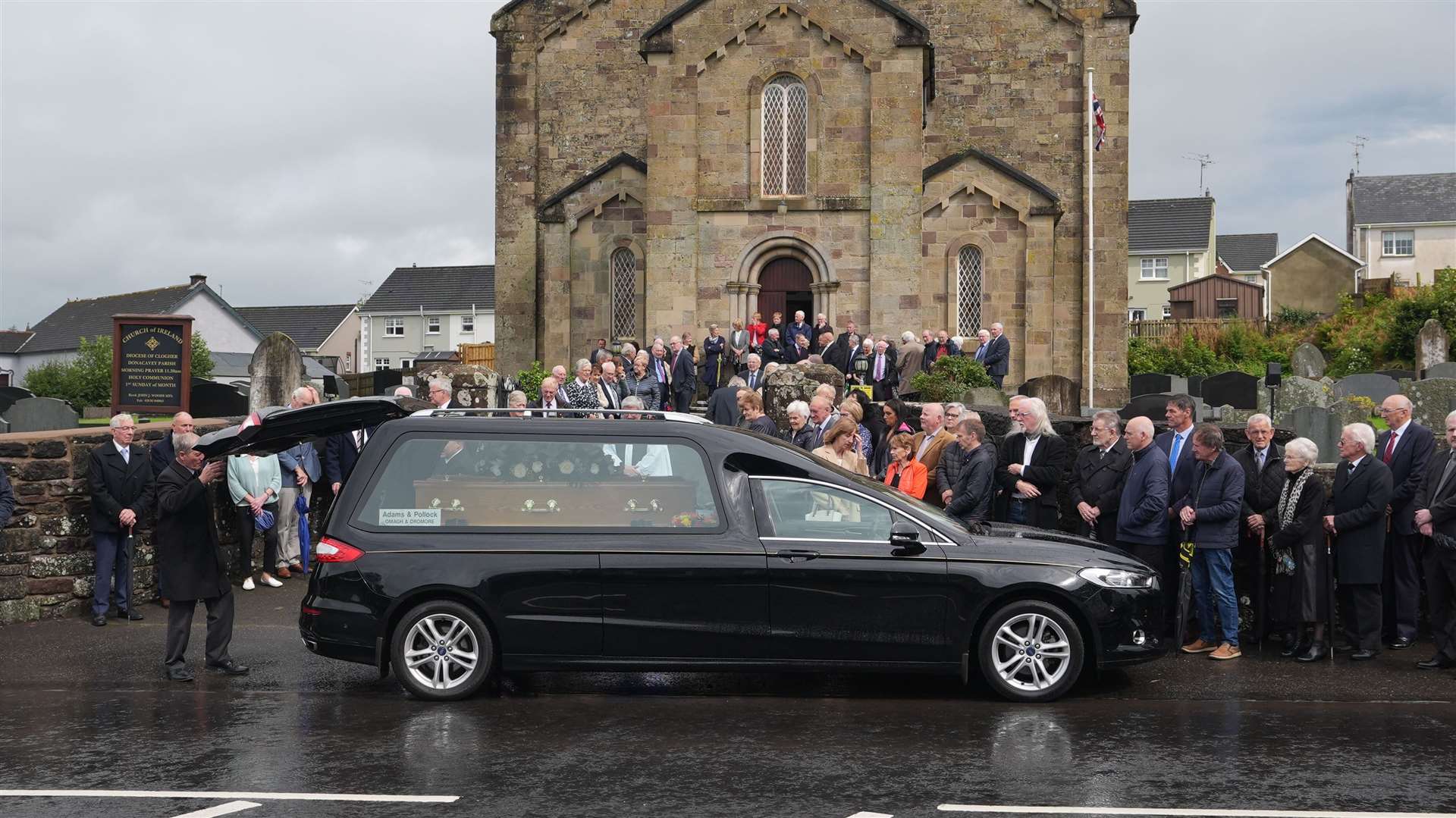 Mourners gathered in rain for Mehaffey’s committal service (Niall Carson/PA)