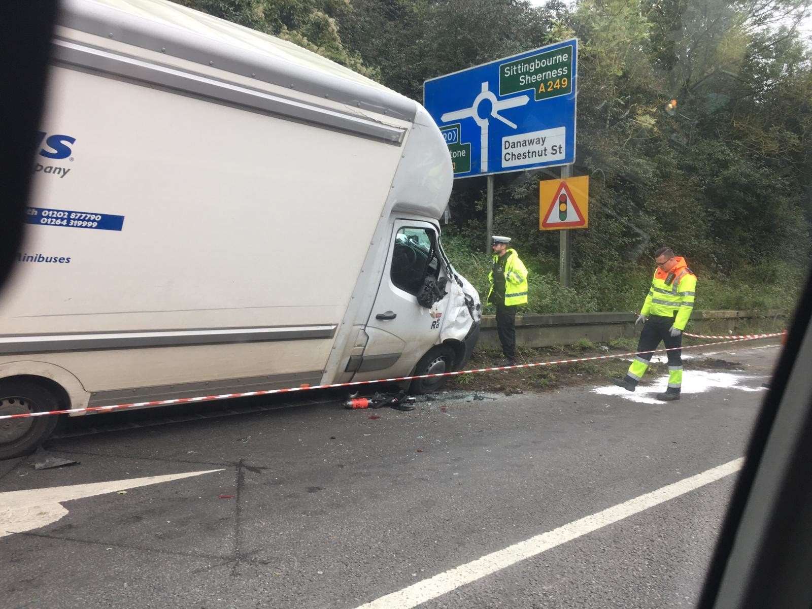 A van has ridden up on the barrier beside the carriageway of the M2 near junction 5