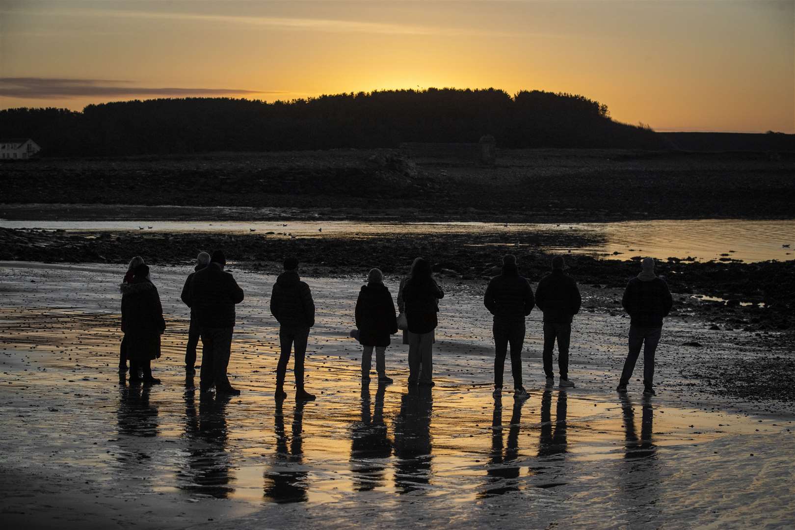 Victims and survivors of the Troubles gather in Killough (Liam McBurney/PA)