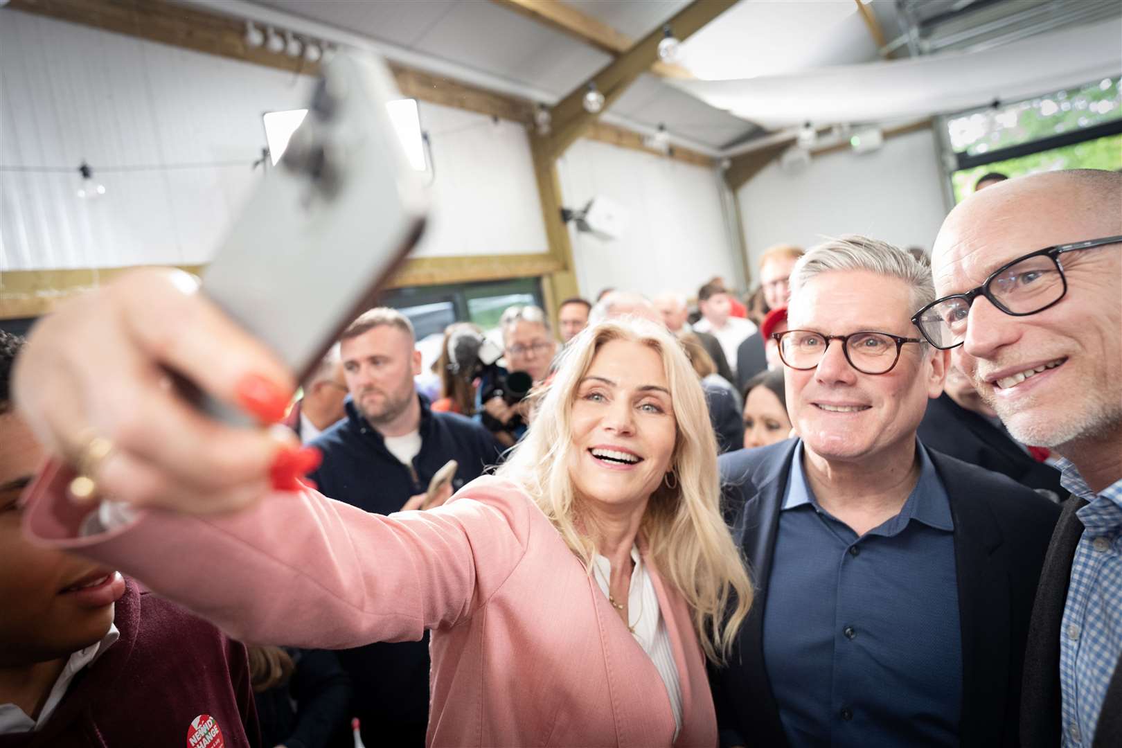 Former Danish prime minister Helle Thorning-Schmidt took a selfie with the Labour Party leader and her husband, Stephen Kinnock (Stefan Rousseau/PA)