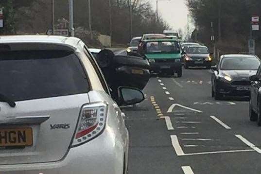 A car has over-turned on Hermitage Lane