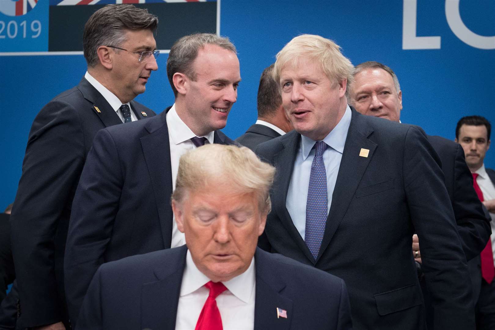 Sharing a joke with Foreign Secretary Dominic Raab after meeting US president Donald Trump during the annual Nato heads of government summit in Watford, Hertfordshire in December 2019 (Stefan Rousseau/PA)