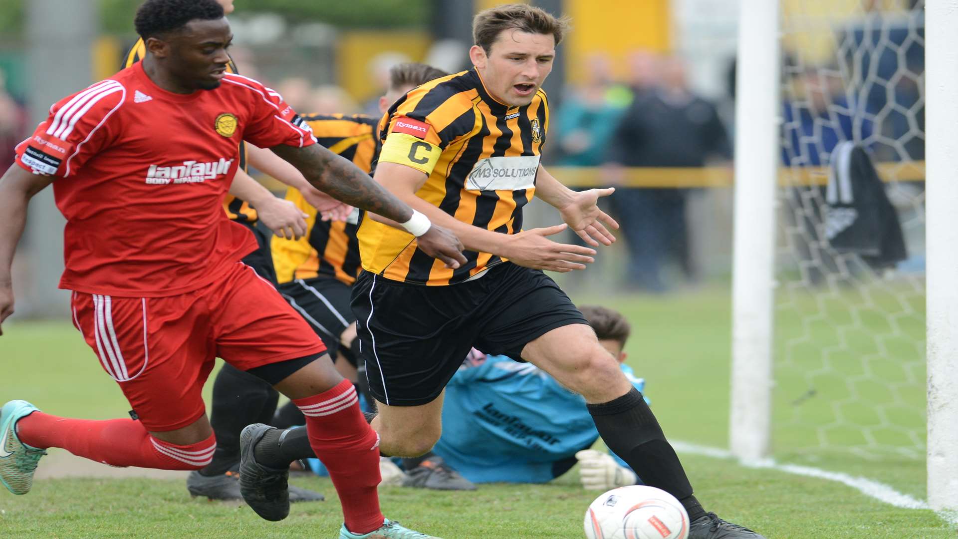 Liam Friend challenges for the ball during the play-off final against Merstham Picture: Gary Browne