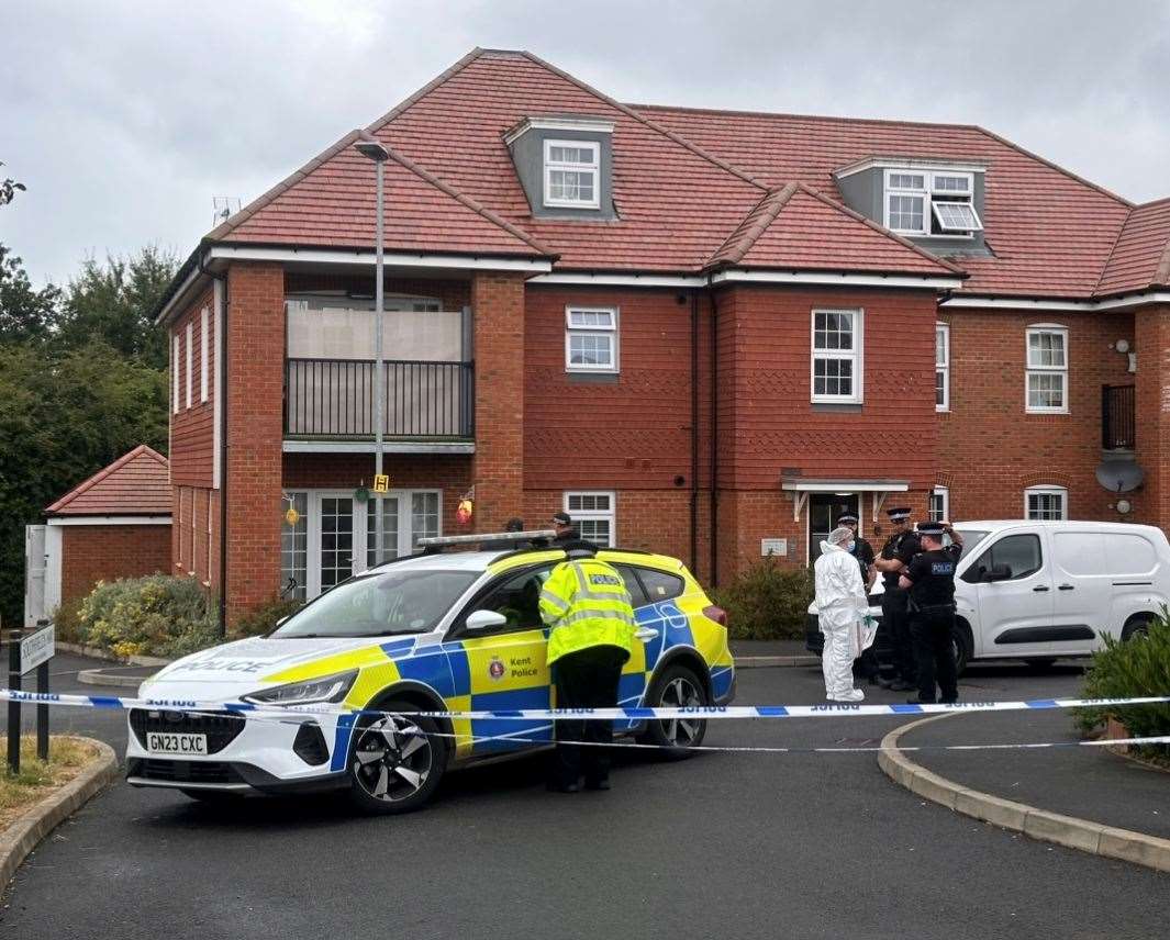 Police and forensic teams at the scene in Southfields Way