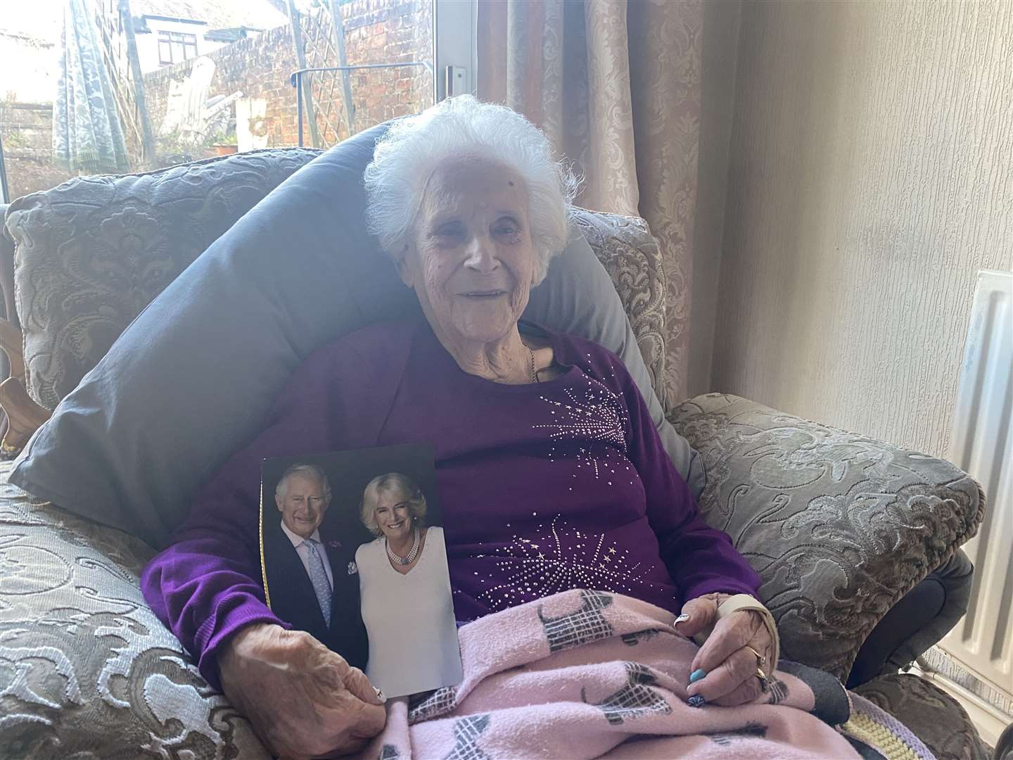 Gladys Banks holding her card from her 'darling' King Charles