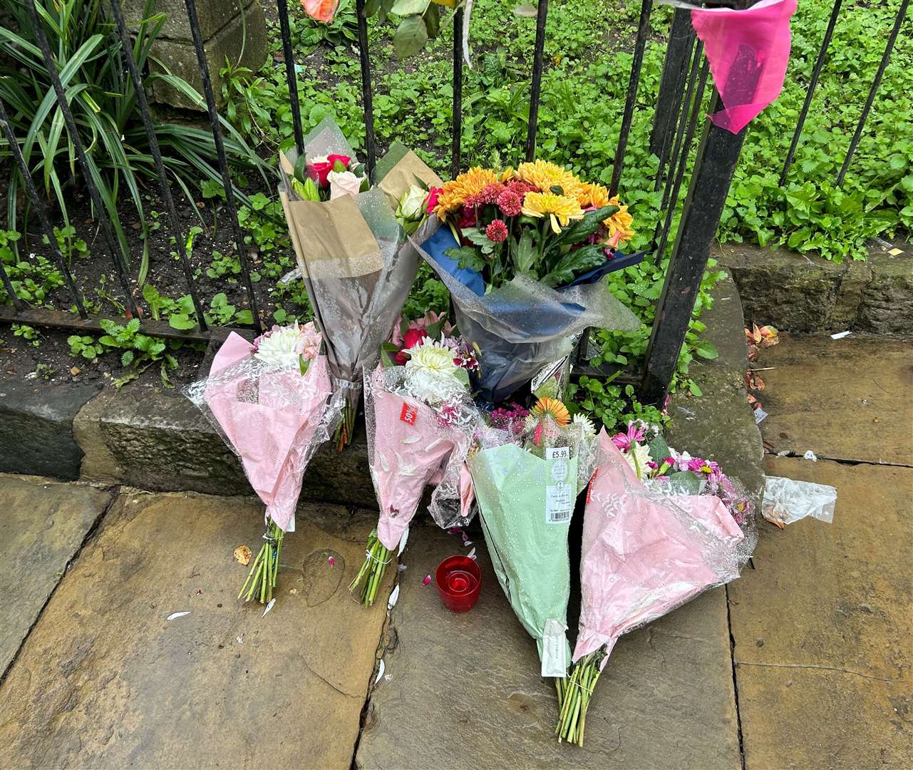 Flowers left at the scene in Canterbury high street where a 23-year-old man was stabbed to death