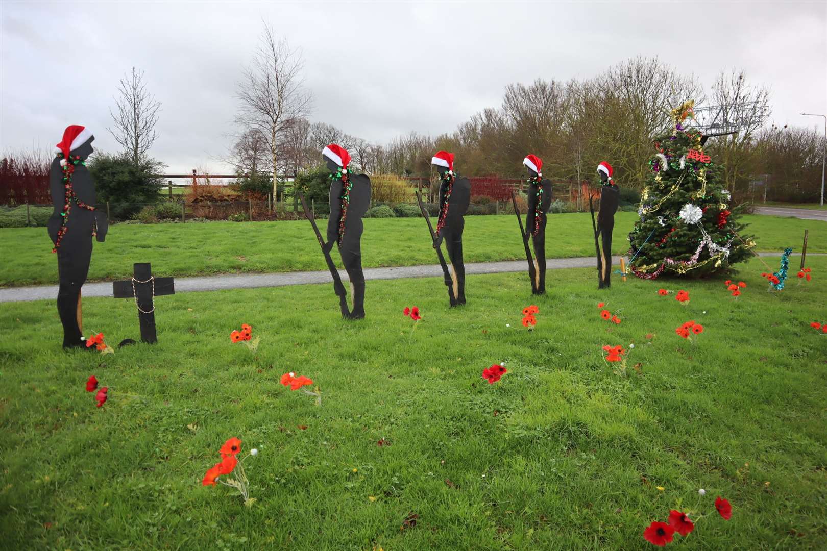 After: the Eastchurch Christmas soldiers with a big tree donated by Stones Nursery