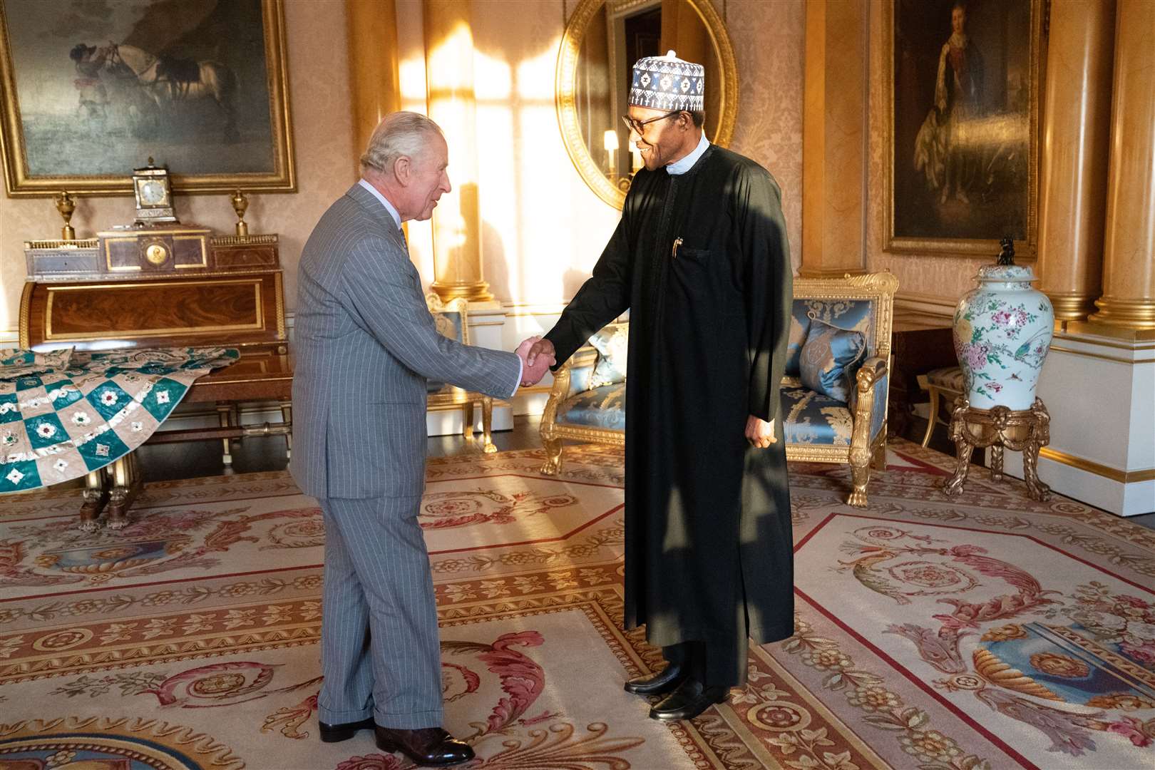 The King during the audience with the President of Nigeria Muhammadu Buhari (Stefan Rousseau/PA)