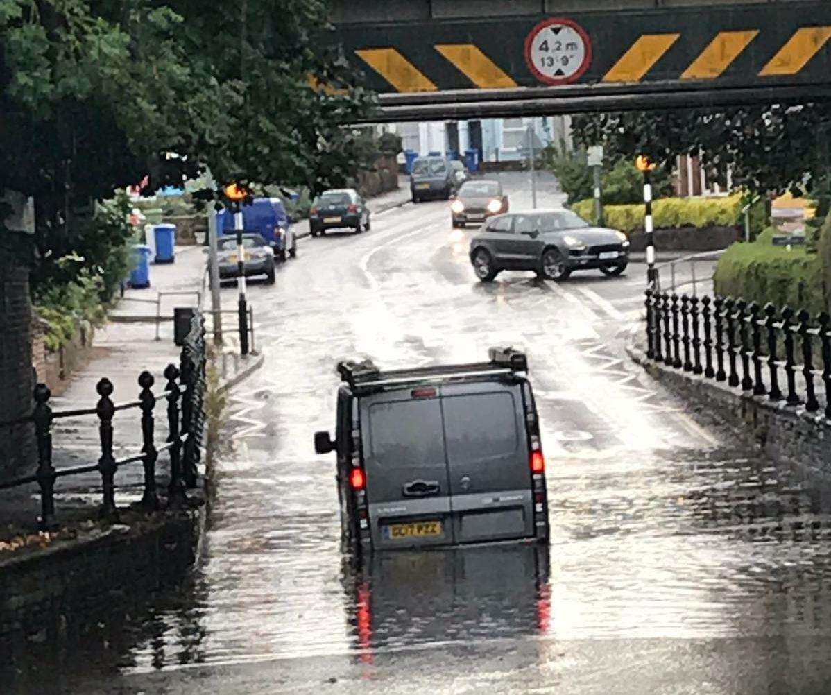 Last night's rain also left the road underneath a rail crossing in Forbes Road flooded