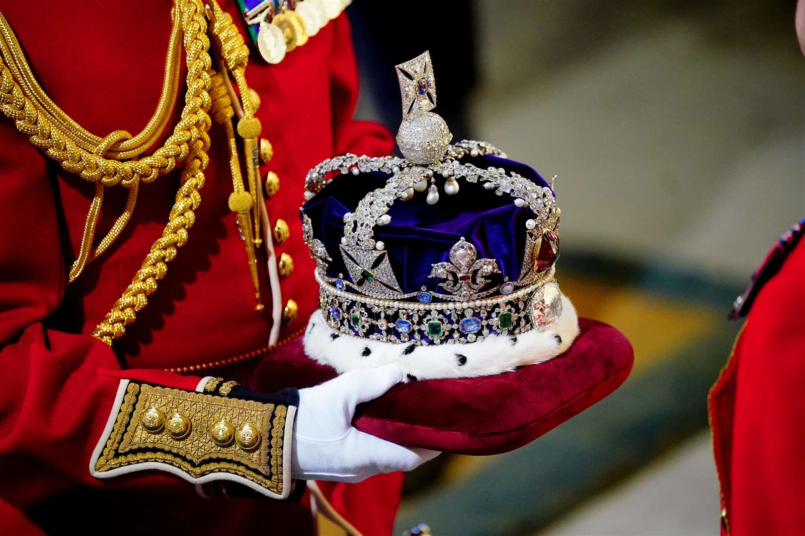 The Imperial State Crown arrives at the Sovereign’s Entrance to the Palace of Westminster (Victoria Jones/PA)