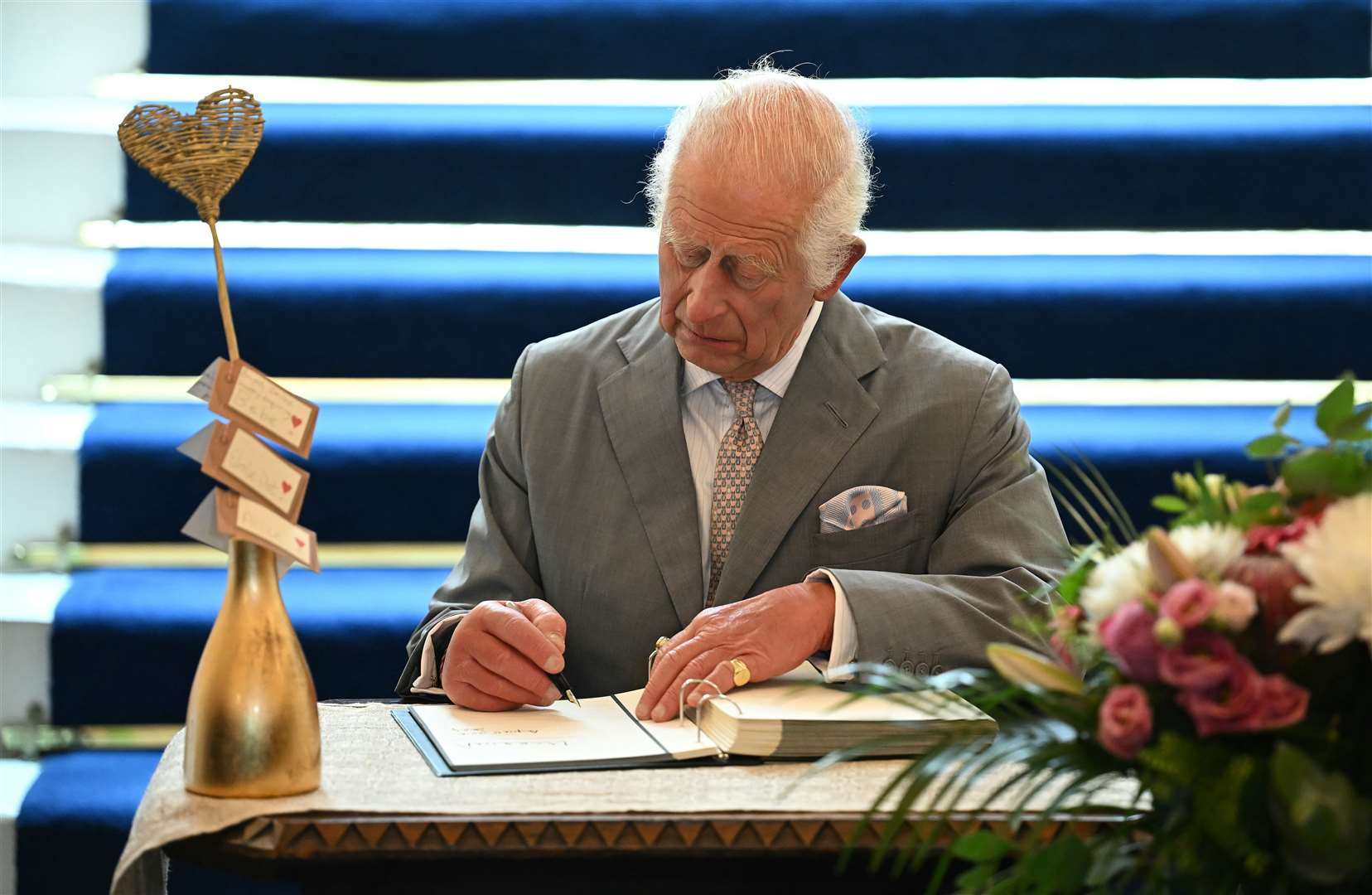 The King signed a book of condolence in the town hall (Paul Ellis/PA)