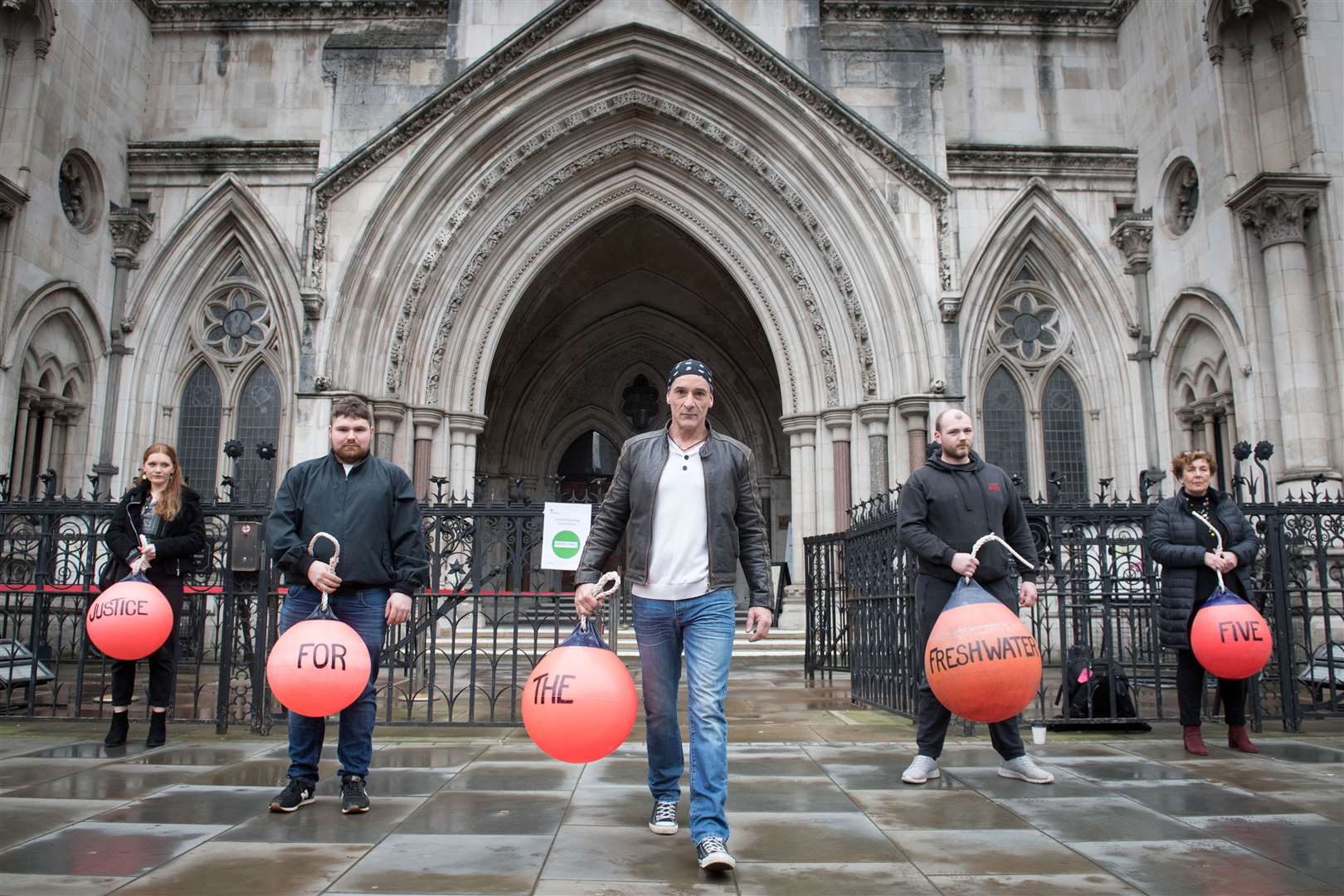 Freshwater Five members Scott Birtwistle (second right) and Daniel Payne (centre) outside the Royal Courts of Justice in February (Stefan Rousseau/PA)