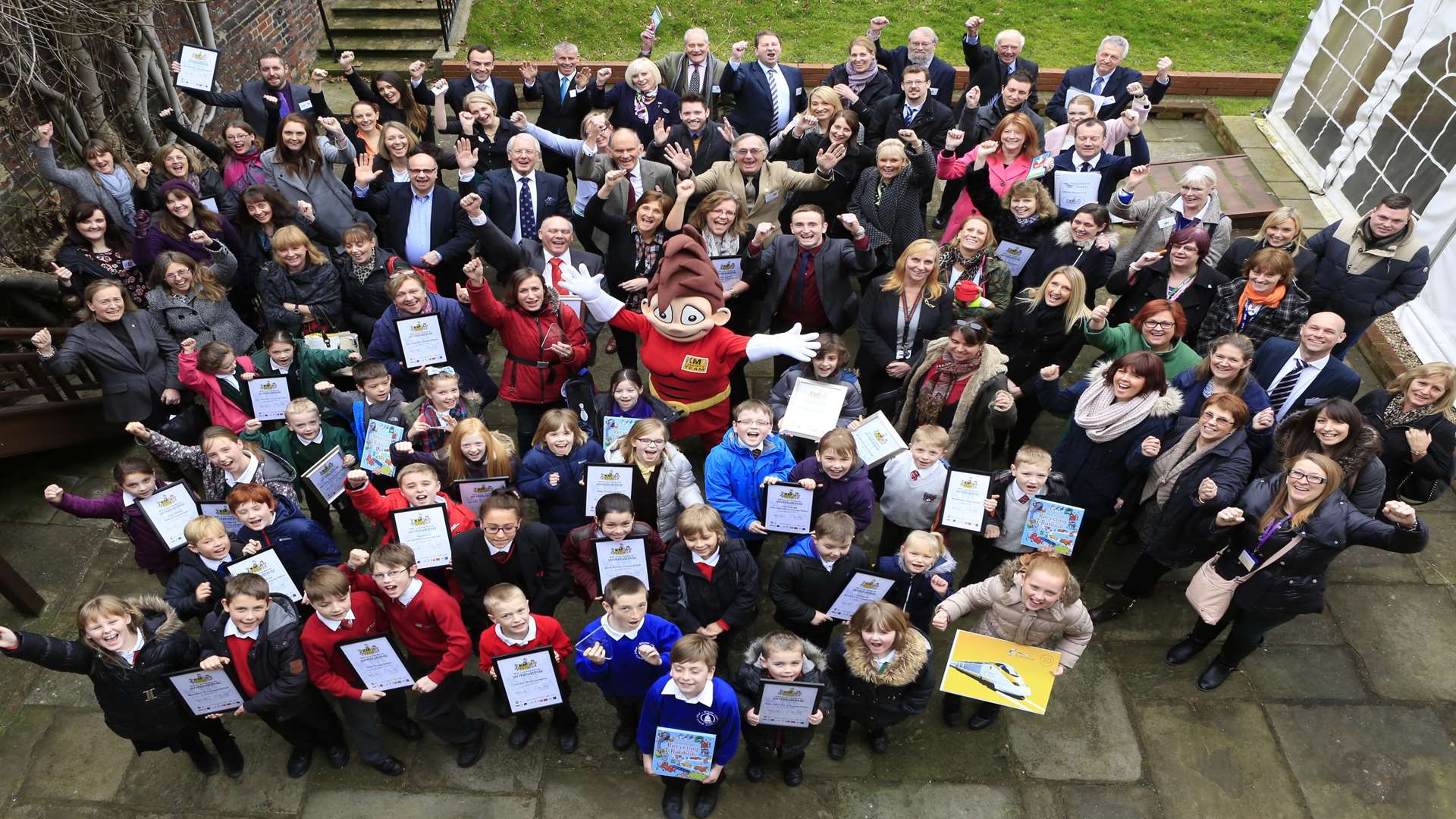 Winning schools from across Kent and Medway celebrate with sponsors and mascot Wowzer at the KM Walk to School Awards, staged by the KM Charity Team at Commissioner's House, Historic Dockyard in Chatham.