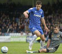 Chris Whelpdale loses the ball following a sliding tackle