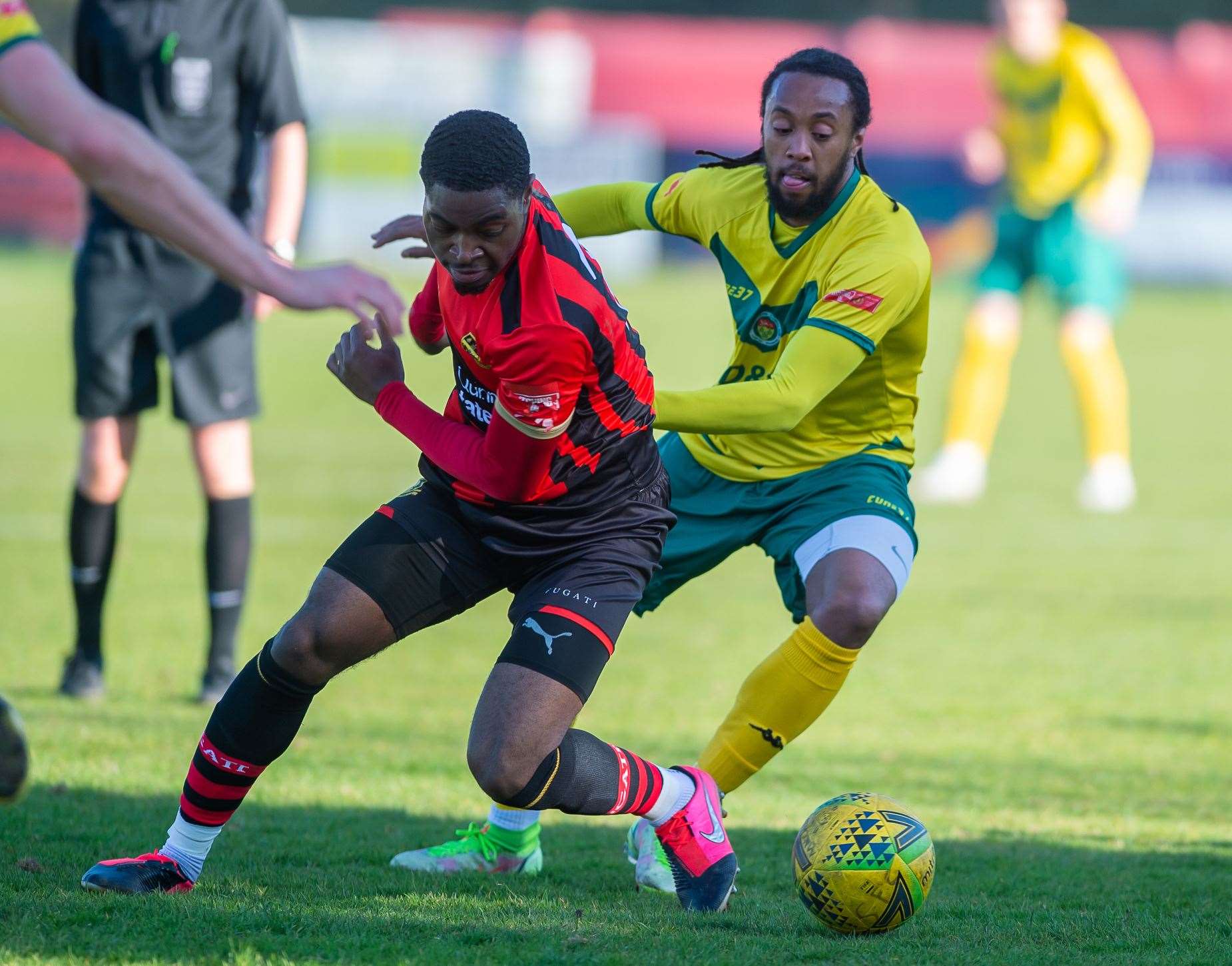 Ashford defender Bradley Simms gets stuck in during the 1-1 draw at Sittingbourne Picture: Ian Scammell