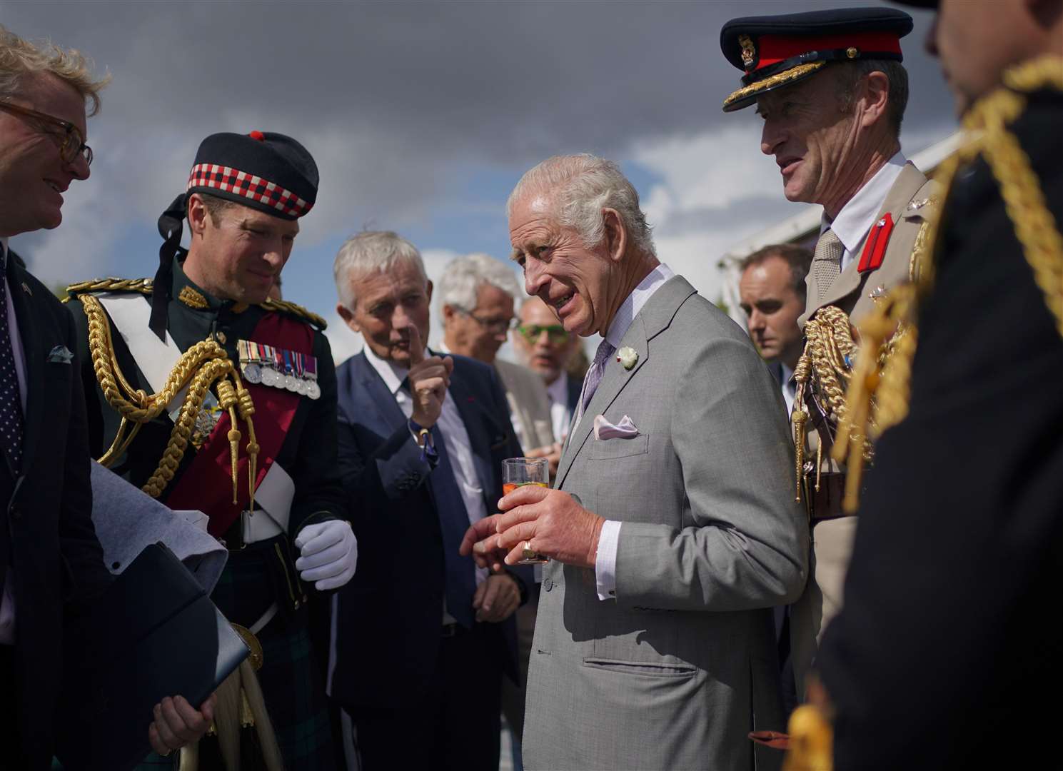 As the King met with guests, he spoke confidently in French (Yui Mok/PA)