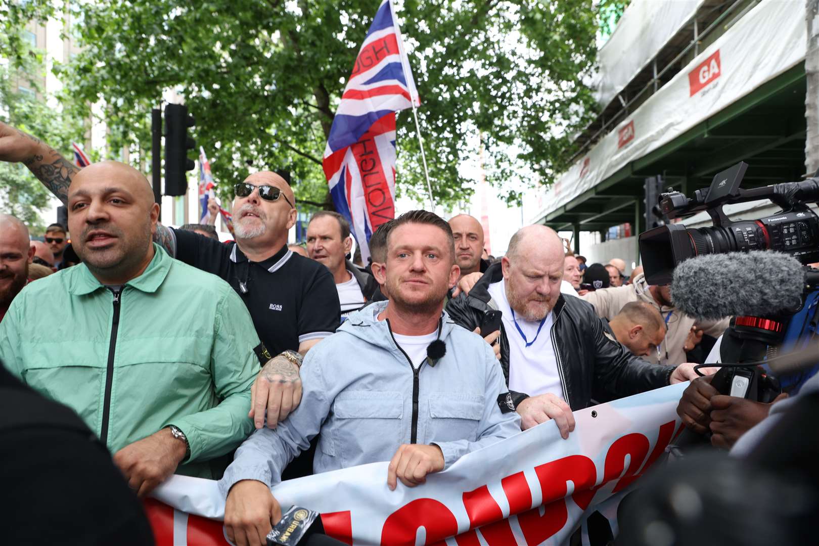 Tommy Robinson (centre) leads a protest march through London in June (David Parry/PA)