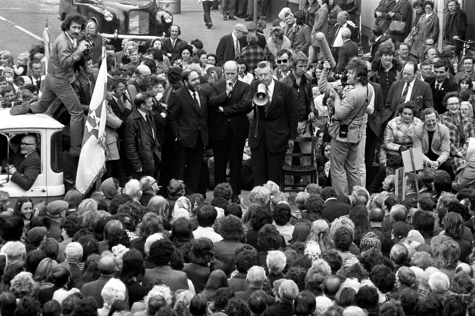 Dr Ian Paisley, gripping a loud speaker during an address to a massed gathering of supporters, in the Protestant Shankill Road area of Belfast in 1974 (PA)