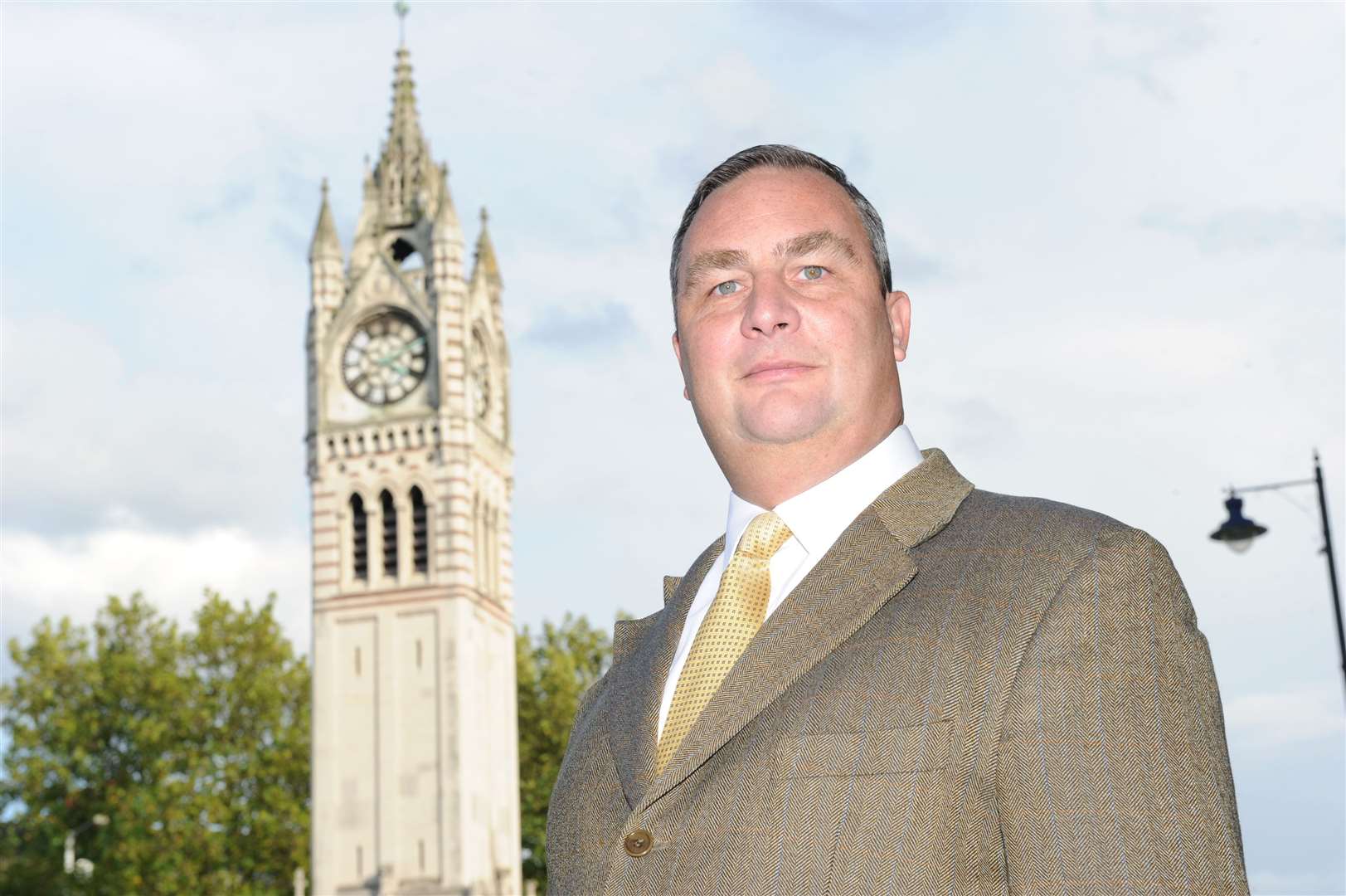 Cllr John Burden (Lab) stands outside Gravesend's clock tower