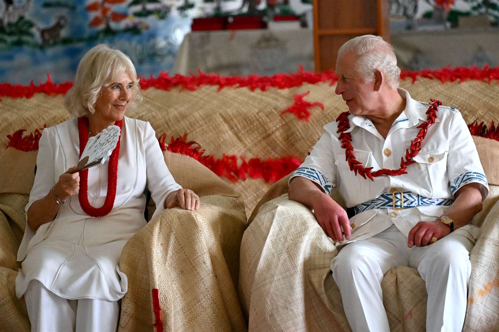 The King and Queen during a traditional ceremonial welcome in Samoa (Victoria Jones/PA)