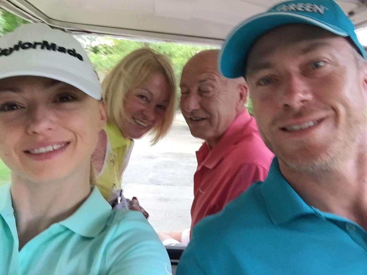 Ola and James Jordan sharing a golf buggy with James' parents Sharon and Allan