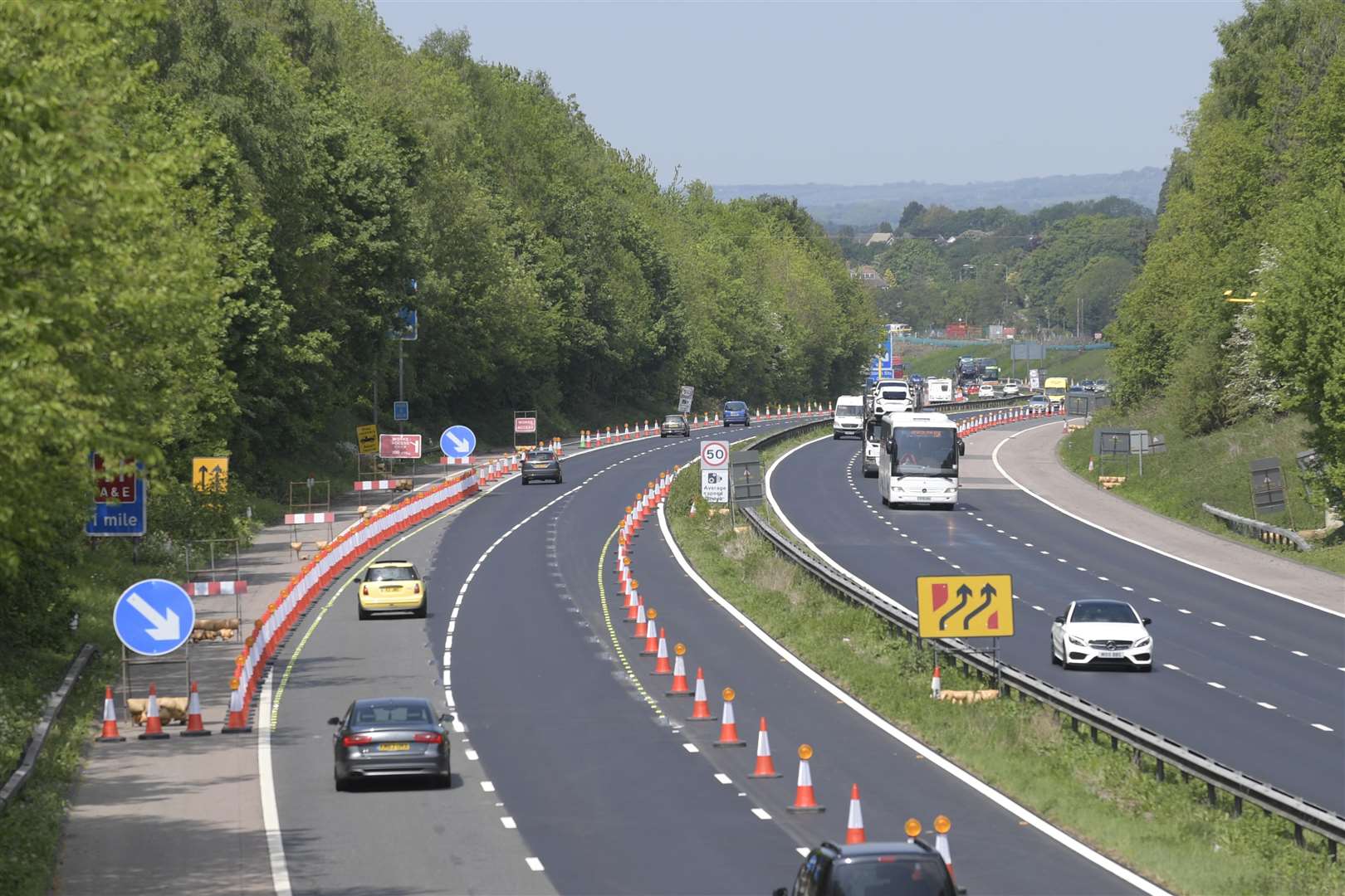 Junction 10 of the M20 showing road works, speed camera signs and average speed cameras..Picture: Barry Goodwin